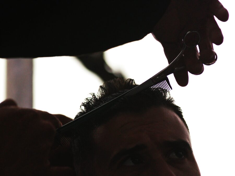 Barber finishing a textured haircut at The Chair Barbershop in Chicago