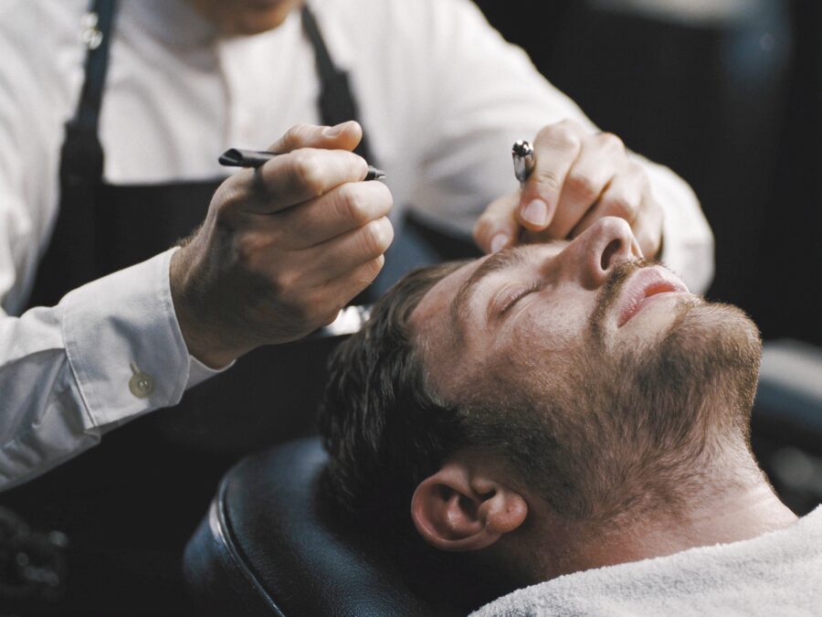A cut in progress on the floor at The Chair Barbershop in Chicago