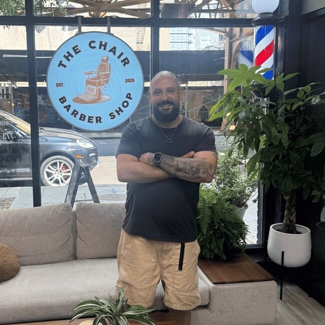 Rock, barber at The Chair Barbershop in Chicago